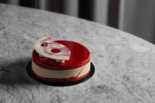 a heart shaped cake sitting on top of a table at Al Habtoor Palace Budapest, Preferred Hotels & Resorts in Budapest