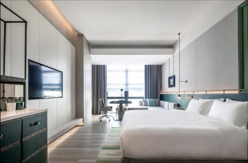 Una cama o camas en una habitación de 深圳英威斯顿酒店 Investon Hotel Shenzhen