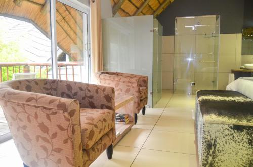 Χώρος καθιστικού στο Highveld Splendour Boutique Bed and Breakfast