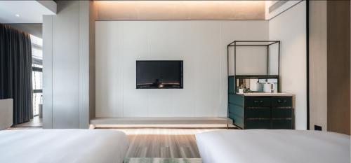Una cama o camas en una habitación de 深圳英威斯顿酒店 Investon Hotel Shenzhen