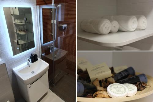 a bathroom with a sink and a toilet and towels at Harmony - Apartmani Tuzla in Tuzla