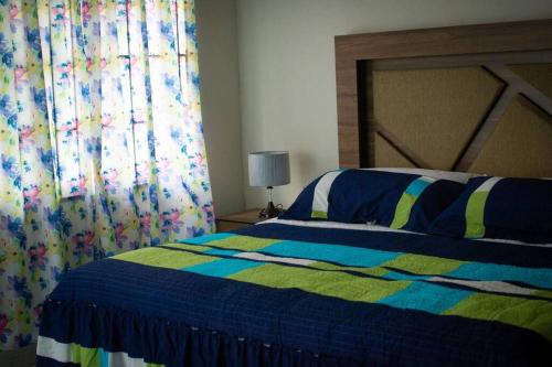 A bed or beds in a room at Tu Casa en Veracruz