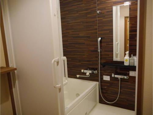 a bathroom with a shower and a tub and a sink at YAKATA - Vacation STAY 58595v in Yuzawa