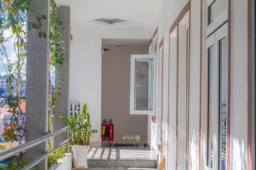 a balcony of a building with plants on it at Ha Khoa Hotel Dalat in Da Lat