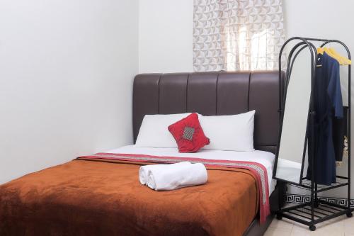 Ένα ή περισσότερα κρεβάτια σε δωμάτιο στο Soka Guesthouse Syariah