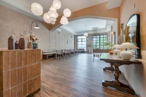 a large living room with a table and chairs at H& Kuma B&B in Jian