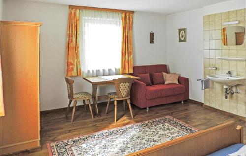 a living room with a couch and a table at Awesome Apartment In Kappl With 3 Bedrooms And Internet in Kappl
