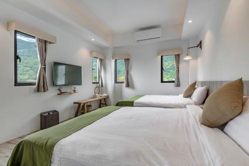 Postel nebo postele na pokoji v ubytování Kuma B&B