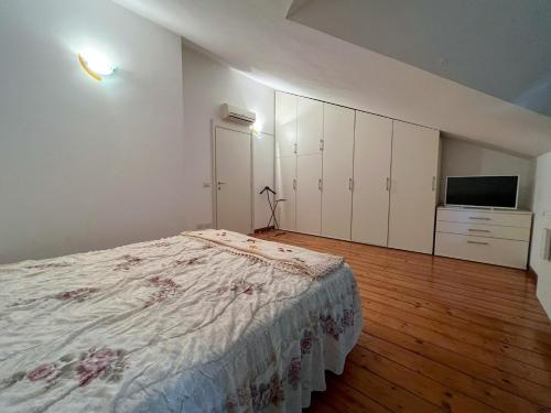 Ένα ή περισσότερα κρεβάτια σε δωμάτιο στο 70 Villetta indipendente con giardino