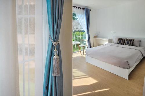 Postel nebo postele na pokoji v ubytování Baan Plawan Resort Chiang Rai
