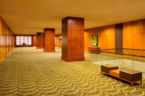 a lobby of a hotel with wooden walls and ailed floor at The Westin Cincinnati in Cincinnati