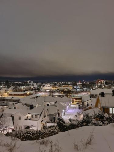an aerial view of a city in the snow at Sjarmerende leilighet i hjerte av Tønsberg by in Tønsberg
