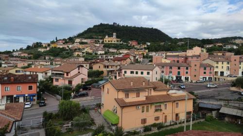 a view of a town with a mountain at Lago di Garda VC, dimora Charme of Butterfly in Cavaion Veronese