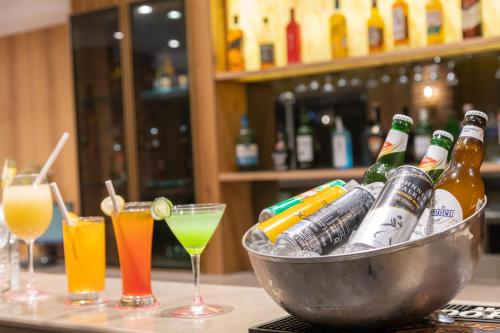 a bowl of beer bottles on a table with drinks at Ramada by Wyndham Kasauli in Kasauli