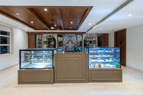 a store with two display cases in a room at Ramada by Wyndham Kasauli in Kasauli