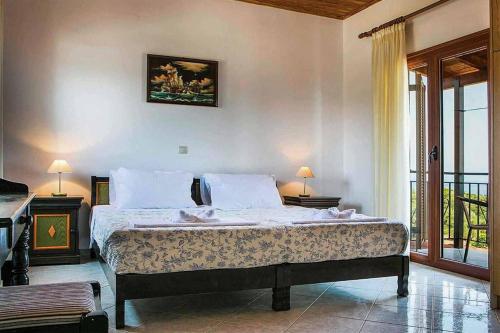 Кровать или кровати в номере Villa Skala Blue