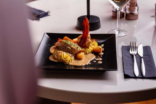 a plate of food on a table with pasta at The Kylestrome in Ayr
