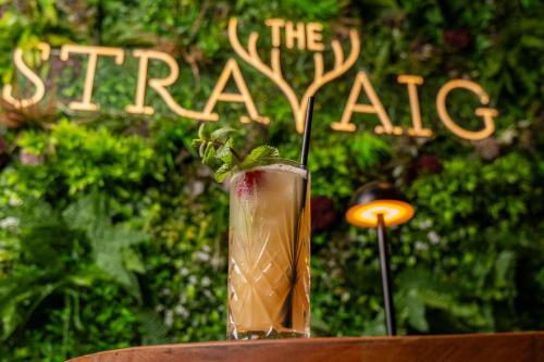a drink sitting on a table next to a sign at The Kylestrome in Ayr