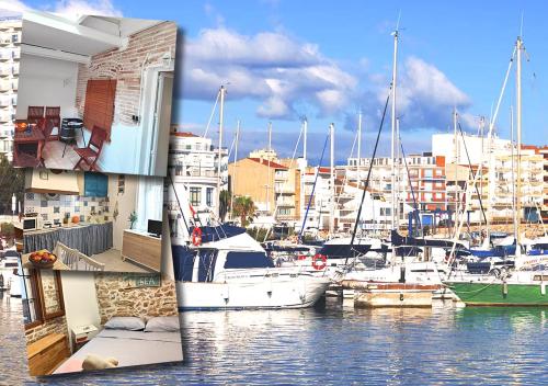a group of boats are docked in a marina at Piso rustico con patio cerca del puerto in L'Ampolla