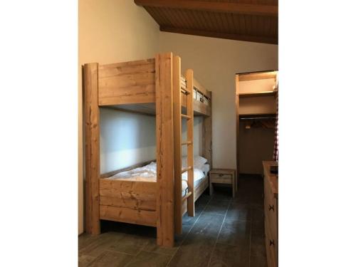 a bedroom with two bunk beds in a room at Almhütte Hannah in Sonnenalpe Nassfeld