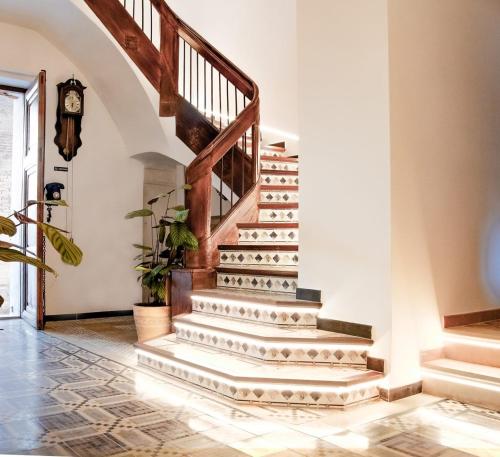 a staircase in a home with a stair case at Hotel 3* La Casona de las Flores in Ondara