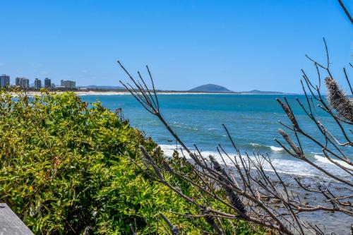 a view of the ocean from a beach at Coastal Chic Apartment - Mooloolaba and Alex in Alexandra Headland