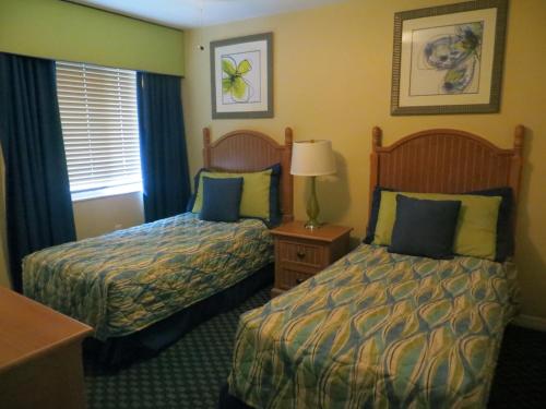 Ένα ή περισσότερα κρεβάτια σε δωμάτιο στο FantasyWorld Resort