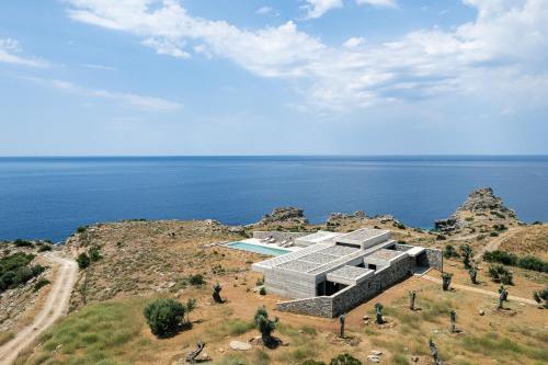 a rendering of a building on top of a mountain at Orizontes Villa, Tranquil SeaView Living, By ThinkVilla in Agios Pavlos