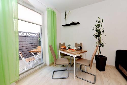 a small dining room with a table and a window at Alte Schmiede in Franken Vorstadt