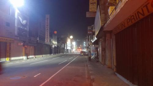 an empty city street at night with lights at agunawala in Angunawala