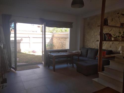 a living room with a couch and a table at Casa Rural Sierra Guadalcanal in Guadalcanal