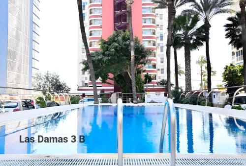a swimming pool in the middle of a city at Las Damas 3B Beach Front - Pool & Parking in Benidorm