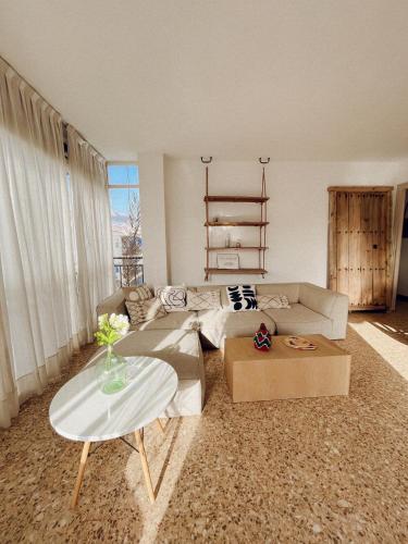 a living room with a couch and a table at Maison Dya Altea in Altea