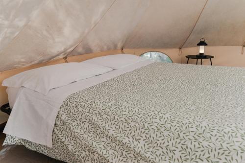 a bedroom with a bed in a tent at Tendù in Chiusanico