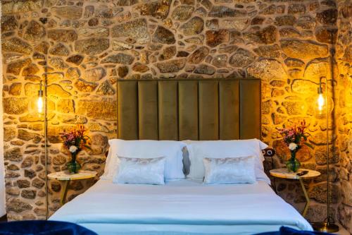 Ένα ή περισσότερα κρεβάτια σε δωμάτιο στο Casa de Lema Boutique