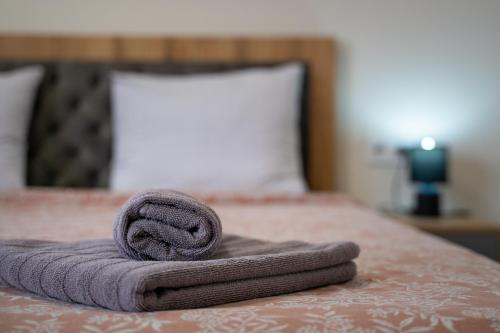 a towel sitting on top of a bed at WOW studios for rent - bul Montevideo 25A - B in Sofia