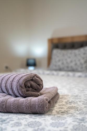 a towel laying on the floor of a bedroom at WOW studios for rent - bul Montevideo 25A - B in Sofia