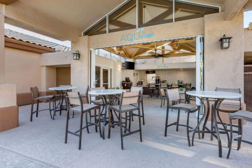 a group of tables and chairs on a patio at Hilton Vacation Club Scottsdale Villa Mirage in Scottsdale