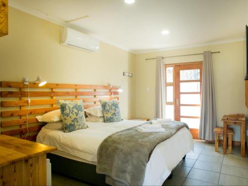 מיטה או מיטות בחדר ב-Nobis House Annex