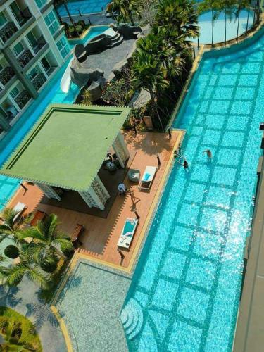 an overhead view of a large swimming pool at dusit grand park 2 pool view in Jomtien Beach