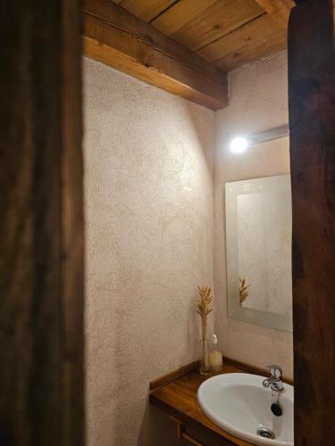 a bathroom with a sink and a mirror at Hotel Rural La Encantada en Riaza in Becerril