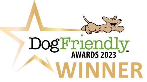 a dog friendly awards logo with a dog running at The Ashleigh - Dog Friendly in Bournemouth