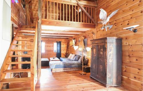 a living room with a staircase in a log cabin at Ferienhaus In Mühldorf in Mühldorf