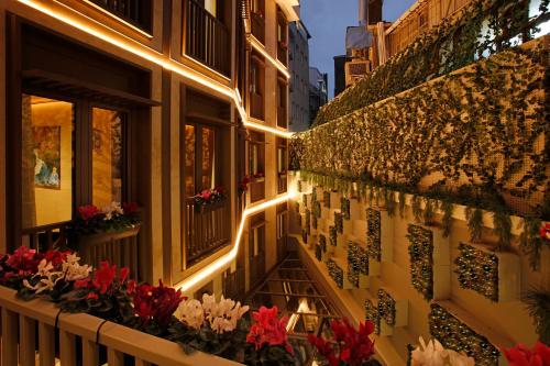 a building with flowers on the side of it at Kate Hotel Special Class & SPA in Istanbul