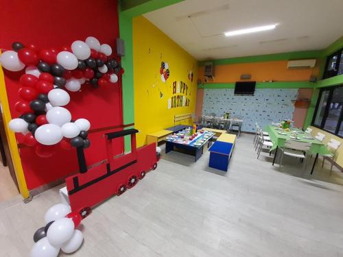 a room with a train and balloons in a classroom at Sunshine in Gevgelija