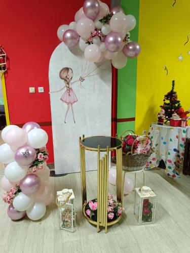 a bunch of balloons and a table with a bunch of decorations at Sunshine in Gevgelija