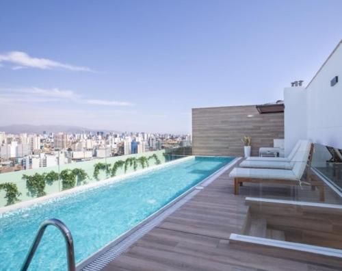 a swimming pool on the roof of a building at Departamento de estreno - Pueblo libre in Lima