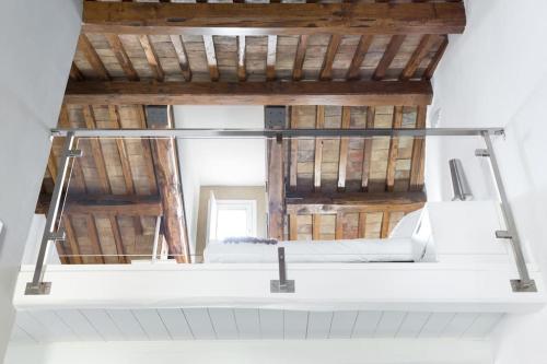 a room with a bed and a mirror at La Colombaia Nel Castello in Bracciano