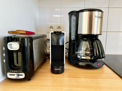a coffeemaker and a coffee maker on a counter at COC - Basse Mer in Wissant