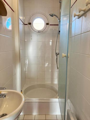 a bathroom with a shower and a sink at COC - Basse Mer in Wissant